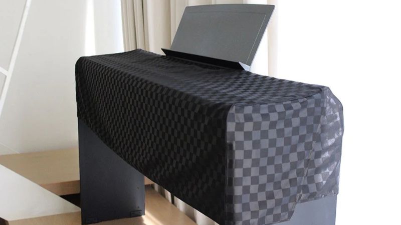 Bảo quản đàn piano không dùng dài hạn: Hướng dẫn A-Z 5 Sử dụng khăn phủ giúp đàn piano tránh bụi bẩn và trầy xước