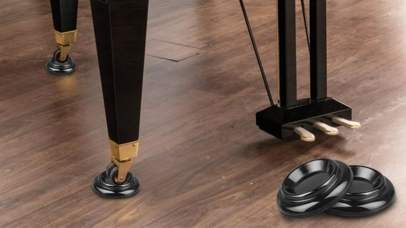 Tiêu chuẩn an toàn và tải trọng chén kê piano: Bảo vệ đàn & sàn 1 Chén kê piano giúp cố định đàn, giảm rung động và ngăn sàn gỗ bị lún nứt